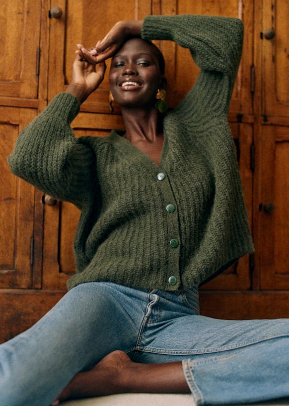 Green sweater and jeans online