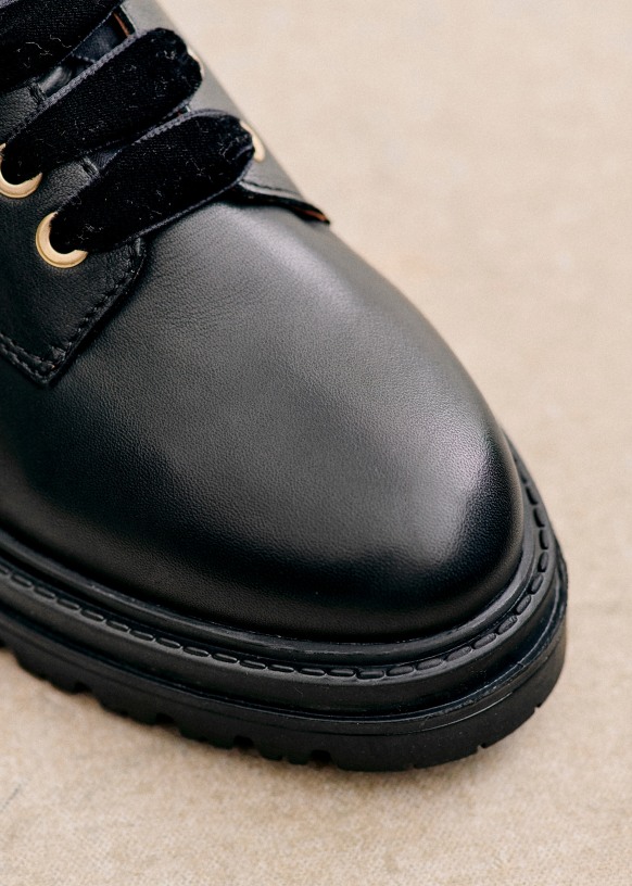 Black boots with gold hardware online